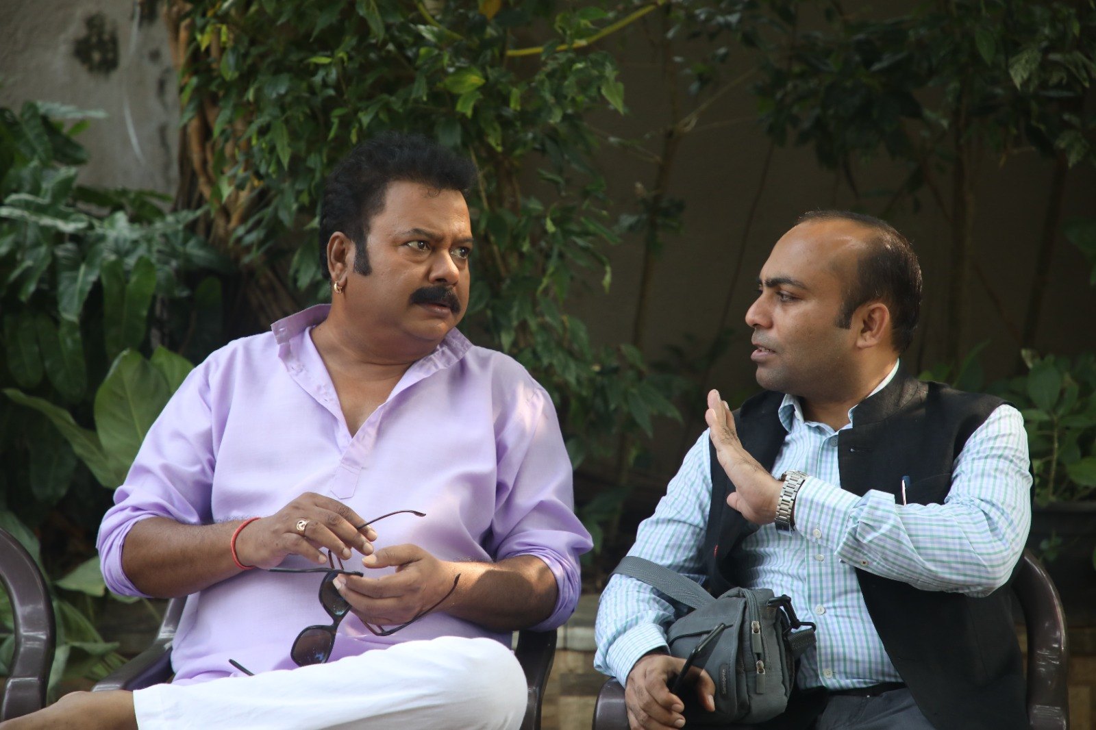 Sanjivkumar Rathod discussing a scene with an actor