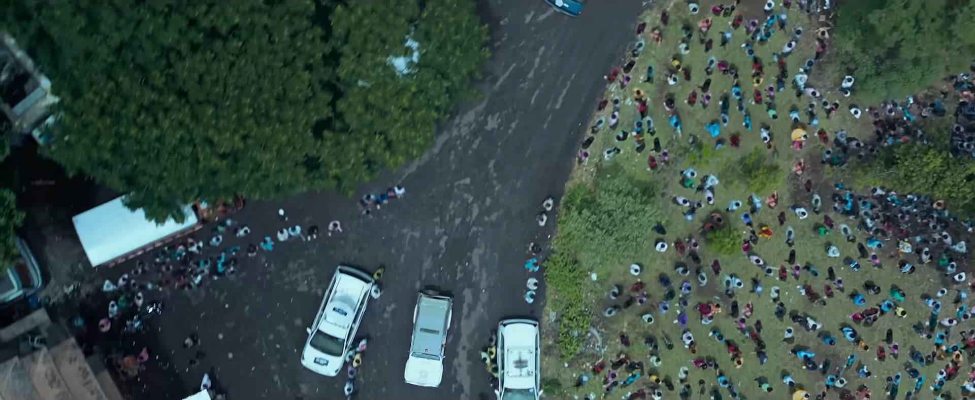 Aerial shot from the film: a large crowd gathered on open ground